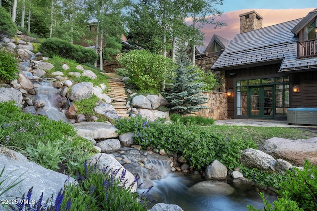 1094 Riva Gln, Vail, CO 81657 - yard at dusk with french doors