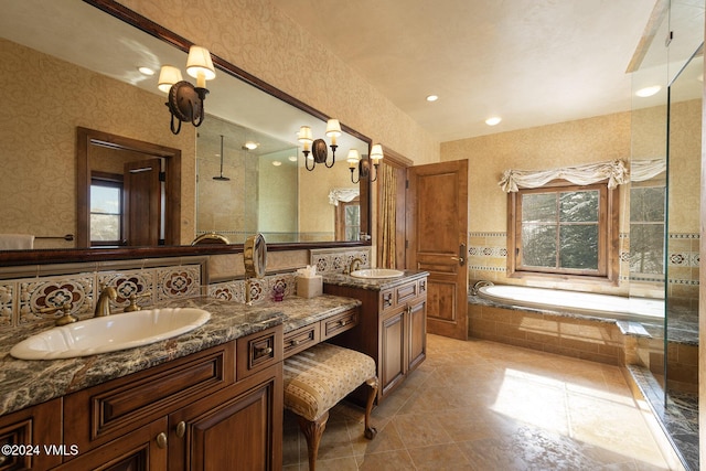1094 Riva Gln, Vail, CO 81657 - bathroom with two vanities, a bath, wallpapered walls, tiled shower, and tile patterned floors