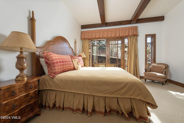 bedroom featuring carpet floors, beamed ceiling, and baseboards