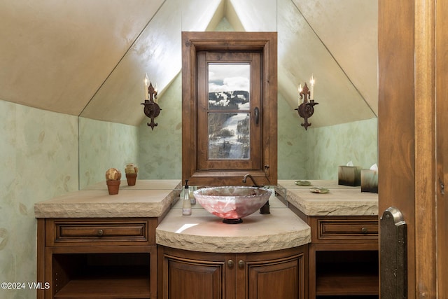 1094 Riva Gln, Vail, CO 81657 - bathroom with vaulted ceiling and vanity