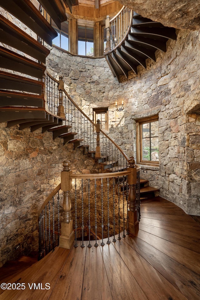 1094 Riva Gln, Vail, CO 81657 - stairs featuring hardwood / wood-style flooring, healthy amount of natural light, and a towering ceiling