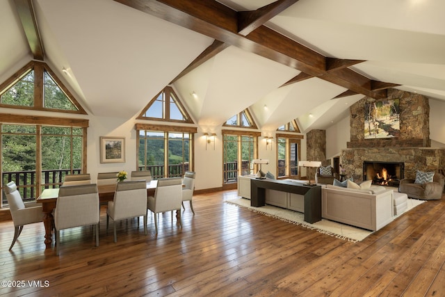 1094 Riva Gln, Vail, CO 81657 - living room with beam ceiling, wood-type flooring, a fireplace, and high vaulted ceiling
