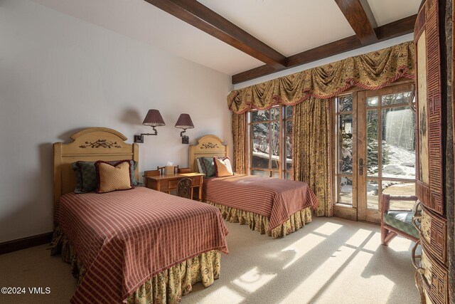 bedroom with carpet floors, access to outside, multiple windows, and beamed ceiling