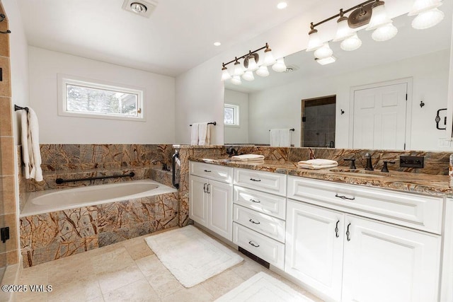 170 Wildflower Unit 12, Edwards, CO 81632 - full bath featuring double vanity, a bath, tile patterned flooring, a tile shower, and recessed lighting