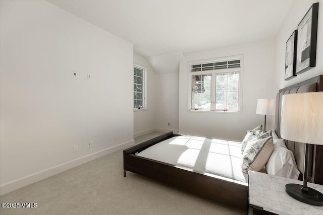170 Wildflower Unit 12, Edwards, CO 81632 - bedroom featuring carpet flooring and vaulted ceiling