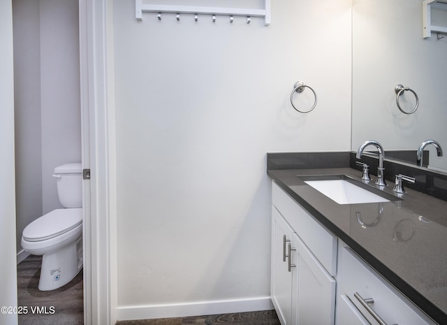804 Chickadee Ln, Gypsum, CO 81637 - bathroom with vanity, toilet, and baseboards
