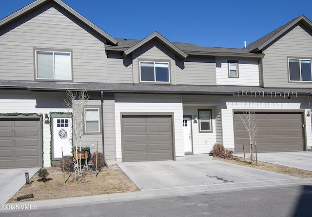 804 Chickadee Ln, Gypsum, CO 81637 - view of property featuring a garage, concrete driveway, and roof with shingles