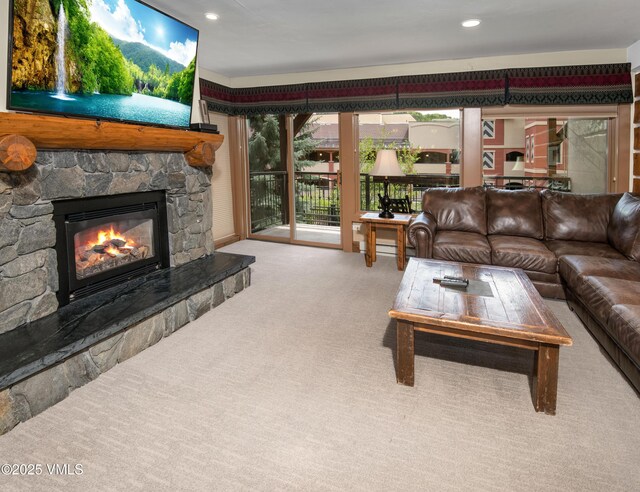 684 W Lionshead Cir Unit 215/216, Vail, CO 81657 - living area featuring a stone fireplace, carpet floors, and recessed lighting
