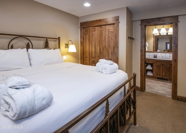 684 W Lionshead Cir Unit 215/216, Vail, CO 81657 - bedroom featuring light colored carpet, recessed lighting, a sink, a closet, and baseboards