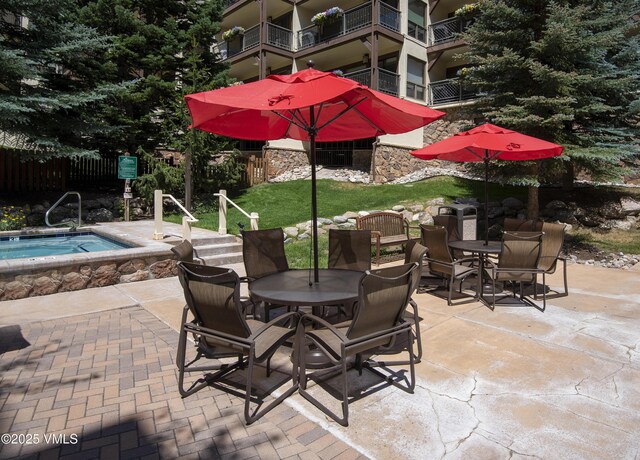 684 W Lionshead Cir Unit 215/216, Vail, CO 81657 - view of patio / terrace with outdoor dining space and a pool