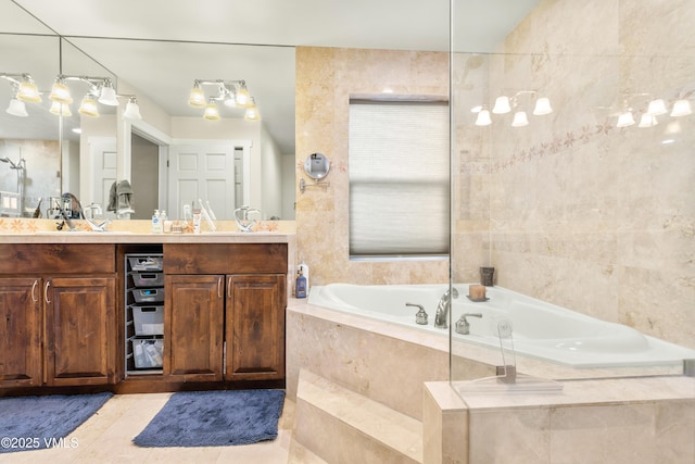 bathroom with vanity, tiled tub, tile patterned floors, and tile walls