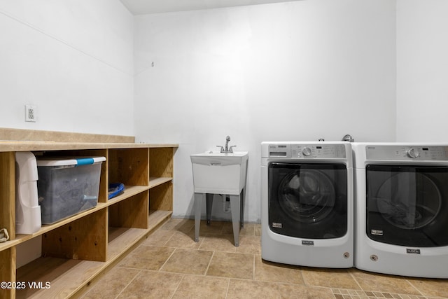 laundry area with washing machine and clothes dryer