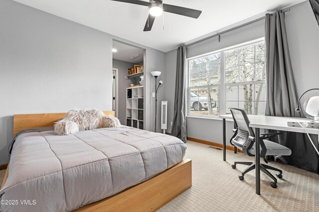 carpeted bedroom featuring ceiling fan