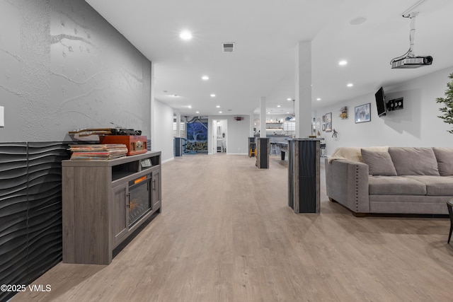 living room with light hardwood / wood-style flooring