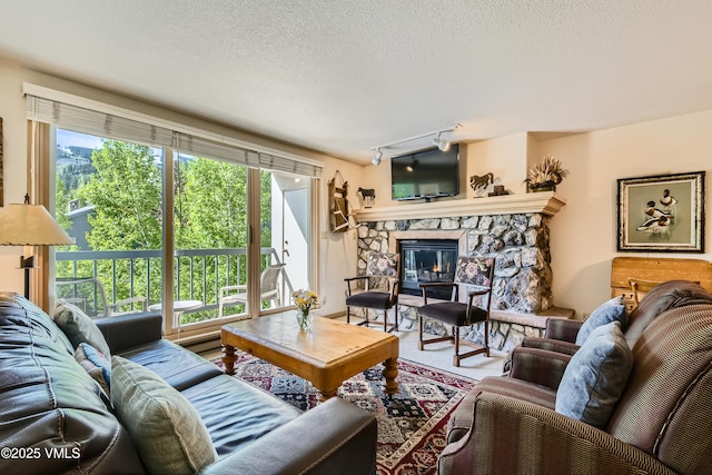 1120 Village Rd Unit 306, Beaver Creek, CO 81620 - living room with a fireplace and a textured ceiling