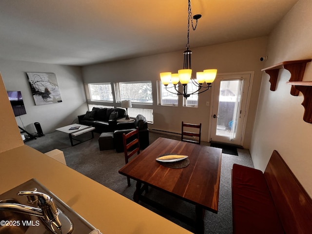 dining room featuring radiator, a wealth of natural light, a chandelier, and carpet flooring