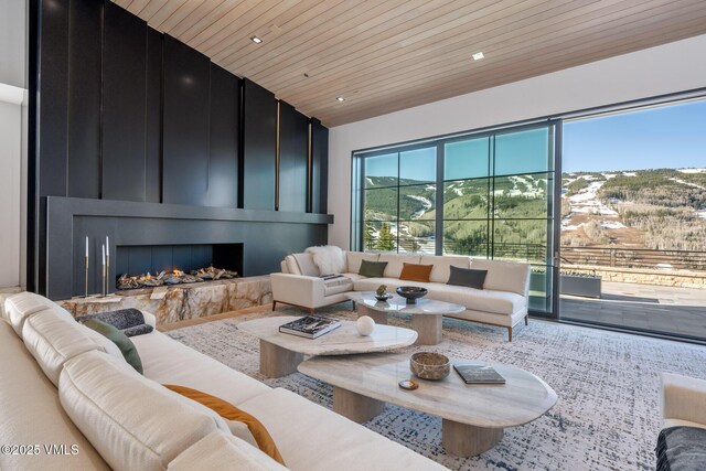 1326 Spraddle Creek Rd, Vail, CO 81657 - living room with wood ceiling, a fireplace, and wood finished floors