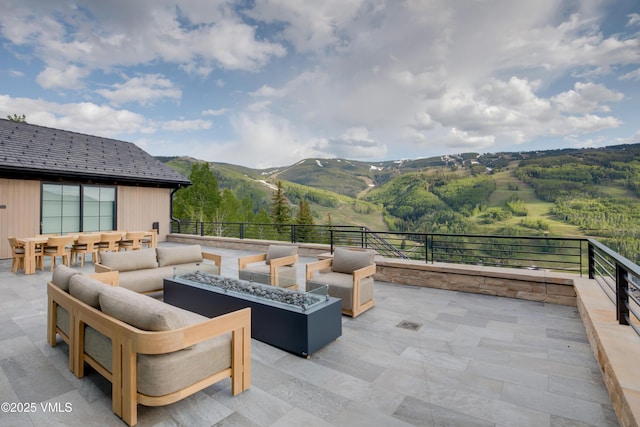 1326 Spraddle Creek Rd, Vail, CO 81657 - view of patio / terrace featuring an outdoor living space with a fire pit and a mountain view