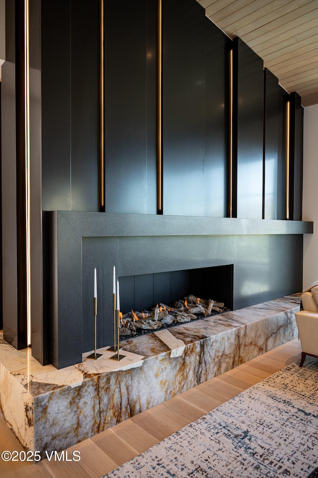 1326 Spraddle Creek Rd, Vail, CO 81657 - detailed view of wood finished floors and a fireplace with raised hearth