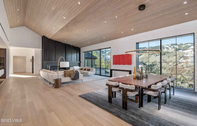 1326 Spraddle Creek Rd, Vail, CO 81657 - dining space featuring high vaulted ceiling, light wood-type flooring, and wood ceiling