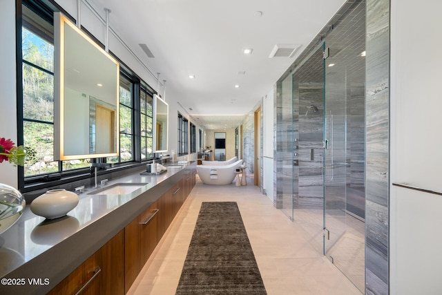 1326 Spraddle Creek Rd, Vail, CO 81657 - full bath featuring a shower stall, plenty of natural light, double vanity, a freestanding bath, and recessed lighting