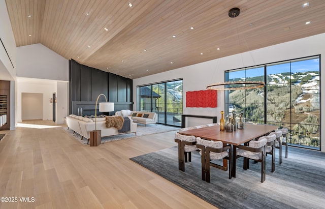 1326 Spraddle Creek Rd, Vail, CO 81657 - dining area featuring high vaulted ceiling, light wood-style flooring, wood ceiling, and recessed lighting