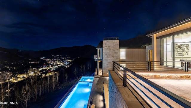 1326 Spraddle Creek Rd, Vail, CO 81657 - view of balcony at twilight