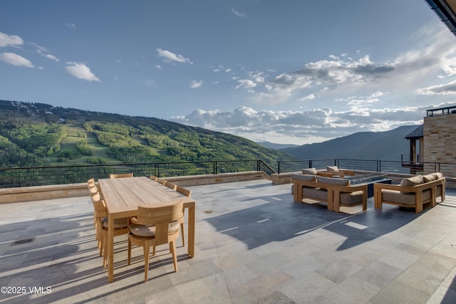 1326 Spraddle Creek Rd, Vail, CO 81657 - view of patio / terrace featuring a mountain view, a fire pit, and outdoor dining space