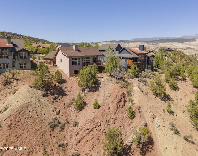 view of front of property featuring a residential view and a mountain view
