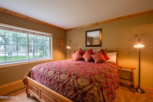 carpeted bedroom featuring ornamental molding