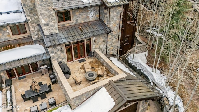 102 Village Walk, Beaver Creek, CO 81620 - rear view of house with french doors, stone siding, and a patio