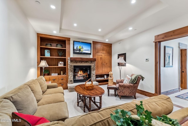 102 Village Walk, Beaver Creek, CO 81620 - living room with a tray ceiling, baseboards, a glass covered fireplace, and recessed lighting