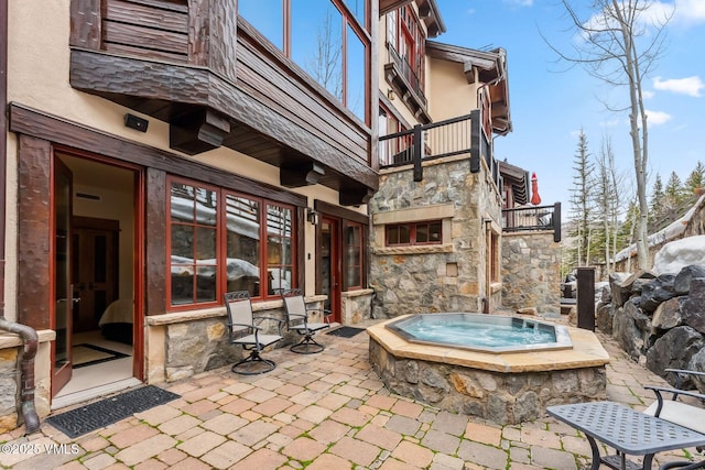 102 Village Walk, Beaver Creek, CO 81620 - view of patio / terrace featuring a jacuzzi and a balcony