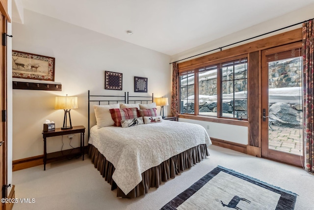 102 Village Walk, Beaver Creek, CO 81620 - carpeted bedroom featuring access to exterior and baseboards