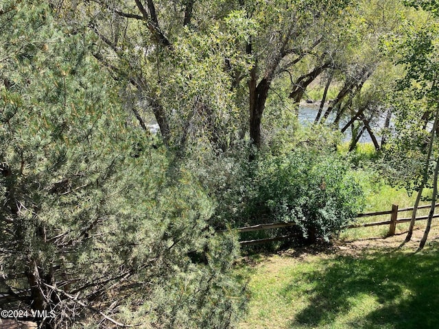 view of landscape featuring a wooded view