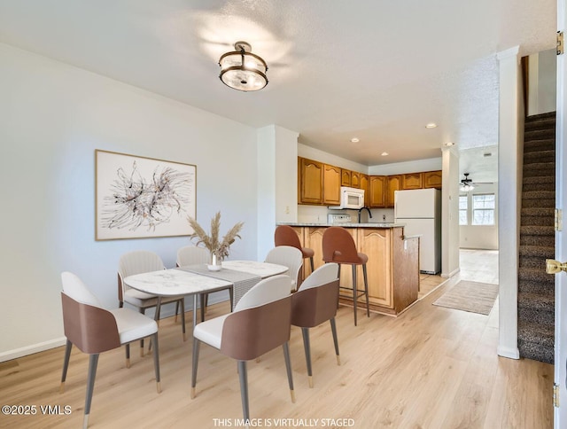 35 Chelsea Ct Unit 9, Eagle, CO 81631 - dining area featuring light wood-type flooring, baseboards, recessed lighting, and stairs