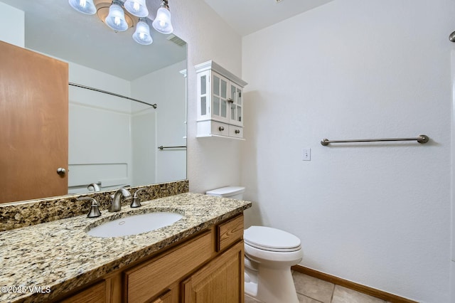 35 Chelsea Ct Unit 9, Eagle, CO 81631 - full bath featuring tile patterned flooring, baseboards, toilet, and vanity