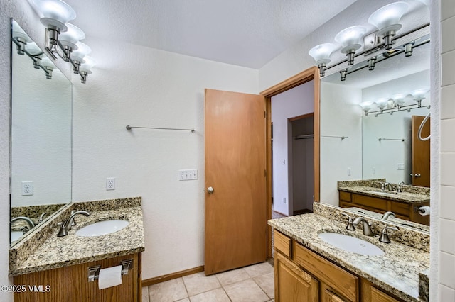 35 Chelsea Ct Unit 9, Eagle, CO 81631 - full bathroom with two vanities, tile patterned floors, and a sink