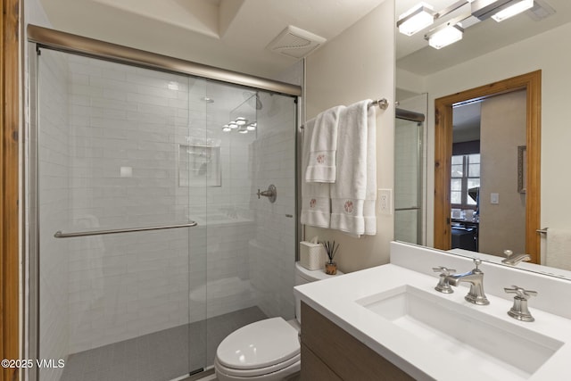 50 Bermuda Dr, Edwards, CO 81632 - full bathroom featuring visible vents, toilet, a shower stall, and vanity