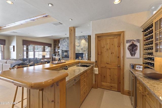 50 Bermuda Dr, Edwards, CO 81632 - kitchen featuring a peninsula, glass insert cabinets, visible vents, dishwasher, and a sink