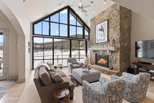 50 Bermuda Dr, Edwards, CO 81632 - living room with a wealth of natural light, a fireplace, high vaulted ceiling, and a ceiling fan