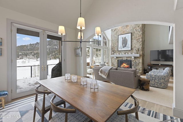 50 Bermuda Dr, Edwards, CO 81632 - dining space with french doors, a wealth of natural light, wood finished floors, and a fireplace