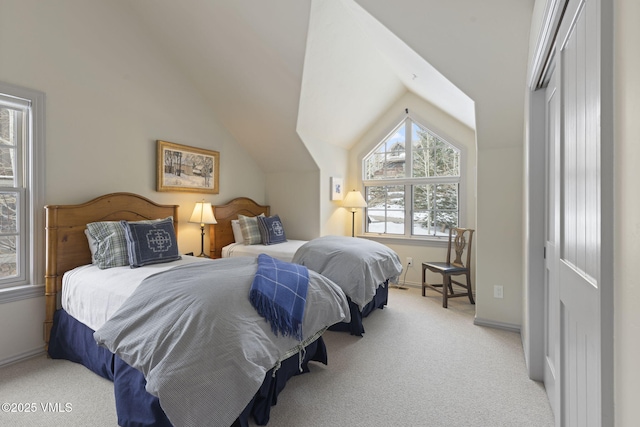 50 Bermuda Dr, Edwards, CO 81632 - bedroom featuring baseboards, light carpet, and lofted ceiling