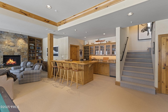 50 Bermuda Dr, Edwards, CO 81632 - bar featuring stainless steel dishwasher, stairway, wet bar, and light carpet