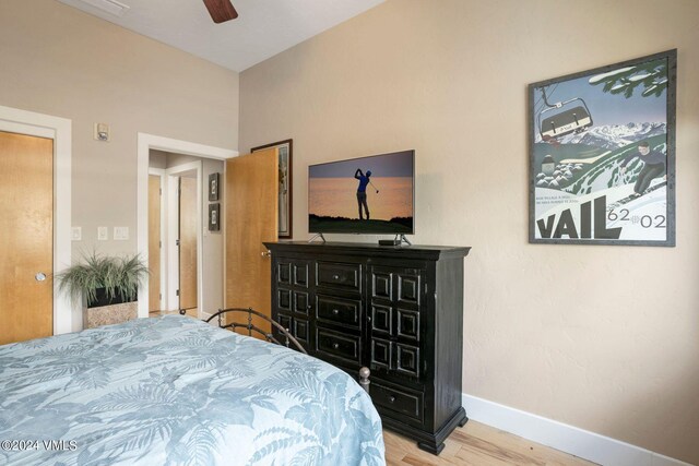 bedroom with hardwood / wood-style flooring and ceiling fan