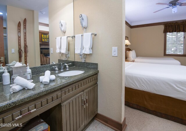 bathroom featuring vanity and ceiling fan