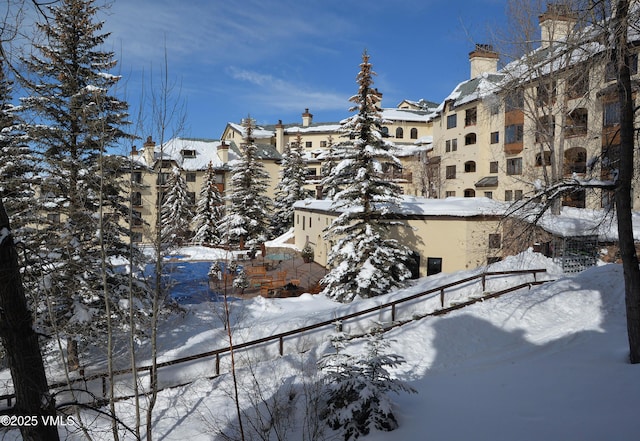 view of snow covered property