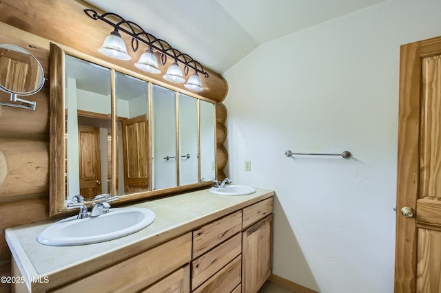 121 Hackamore Rd Unit B, Edwards, CO 81632 - full bathroom featuring double vanity and lofted ceiling