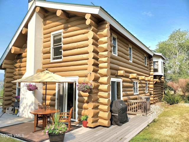 121 Hackamore Rd Unit B, Edwards, CO 81632 - back of property featuring log siding and a wooden deck