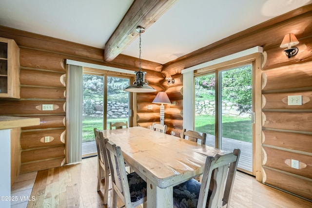 121 Hackamore Rd Unit B, Edwards, CO 81632 - dining space featuring rustic walls, light wood-style floors, and beam ceiling